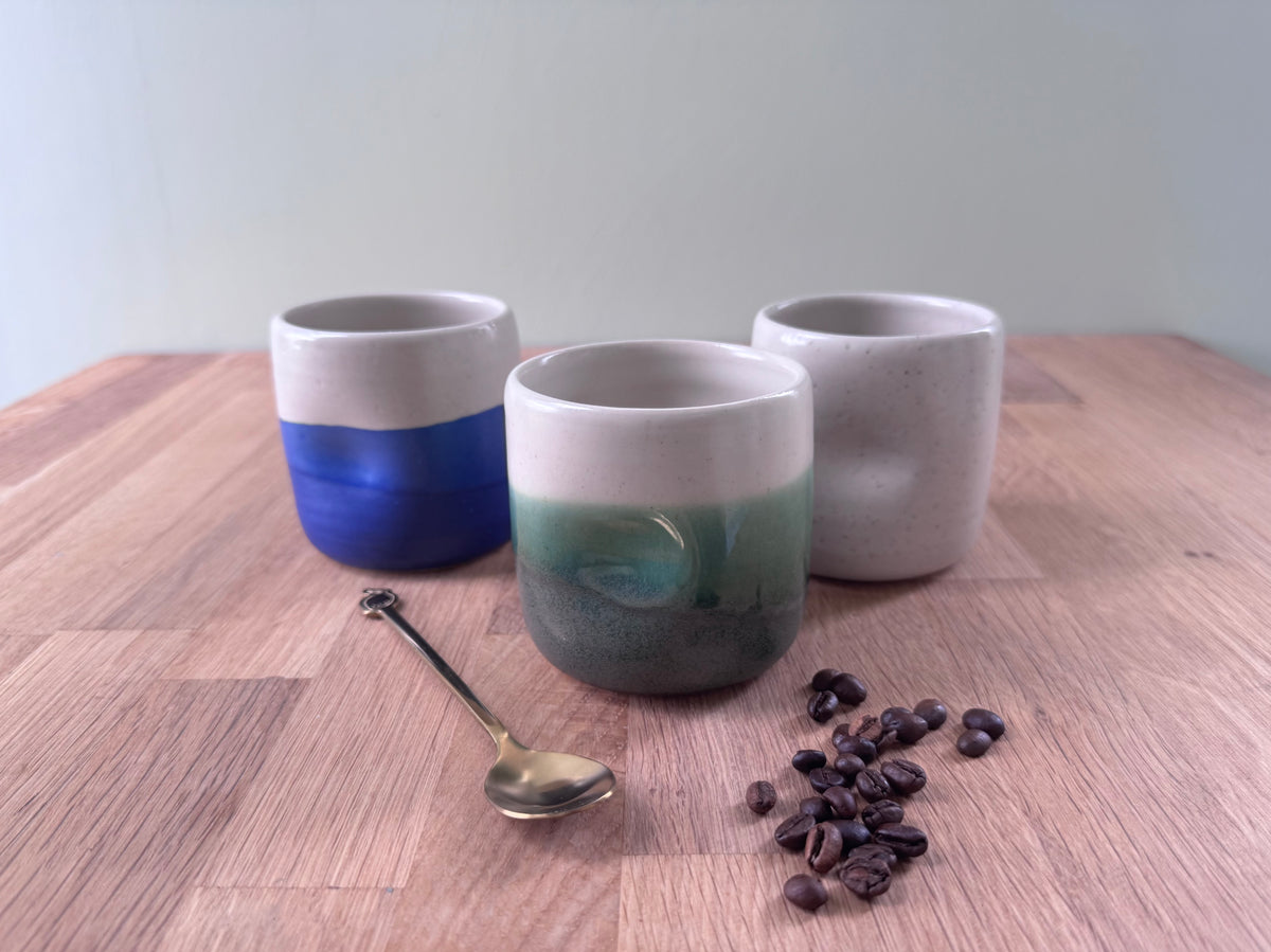 Handmade Ceramic Dimple Cup in a Green and White Glaze